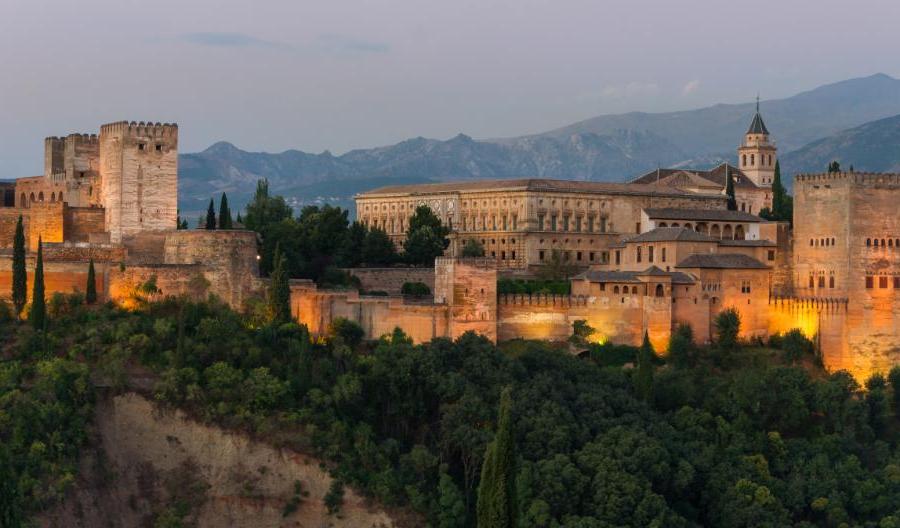 Lights shining on Alhambra, a fortress complex